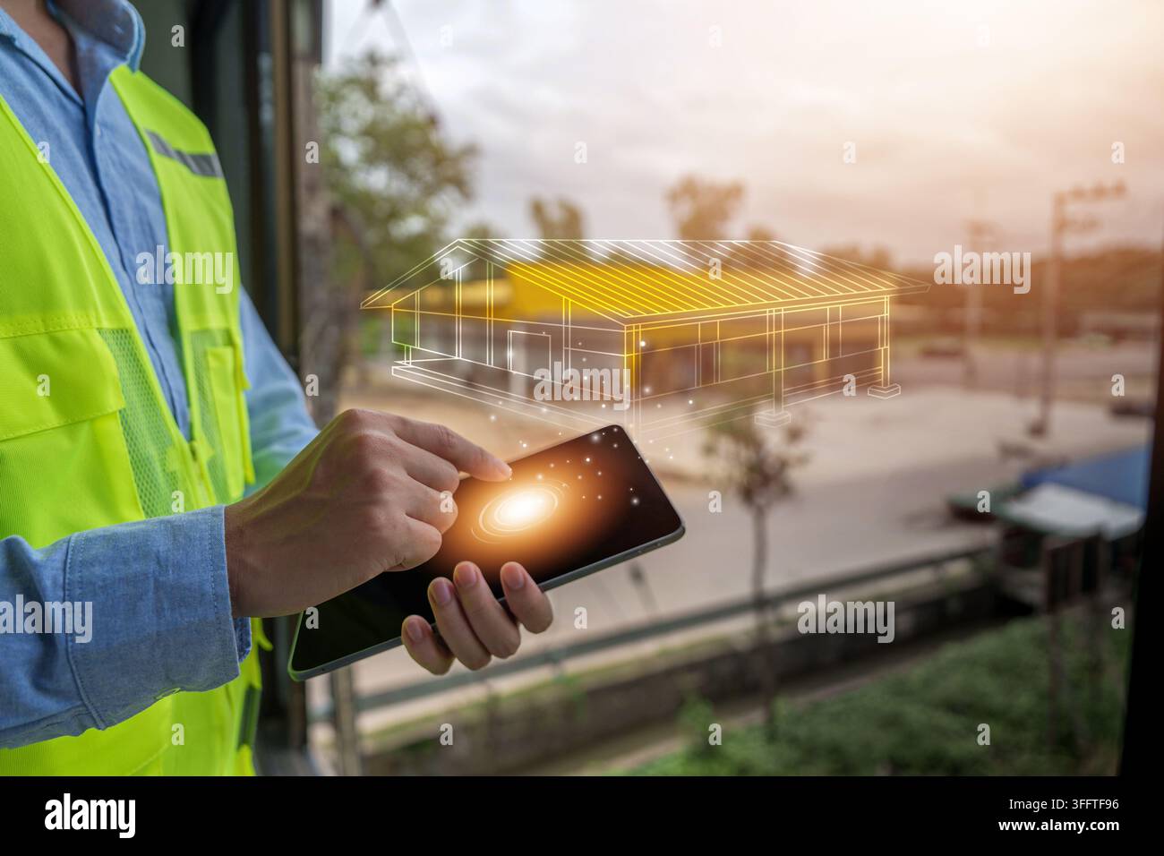 Construction engineer using tablet with digital building blueprint overlay for smart architecture design Stock Photo