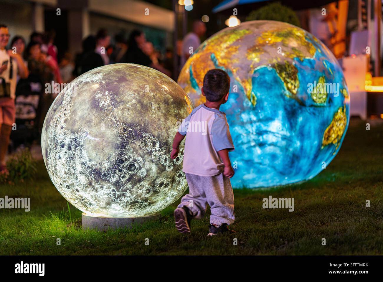 Bishkek Kyrgyzstan September 9 2026 Little Boy Looking At Glowing bishkek-kyrgyzstan-september-9-2026-little-boy-looking-at-glowing