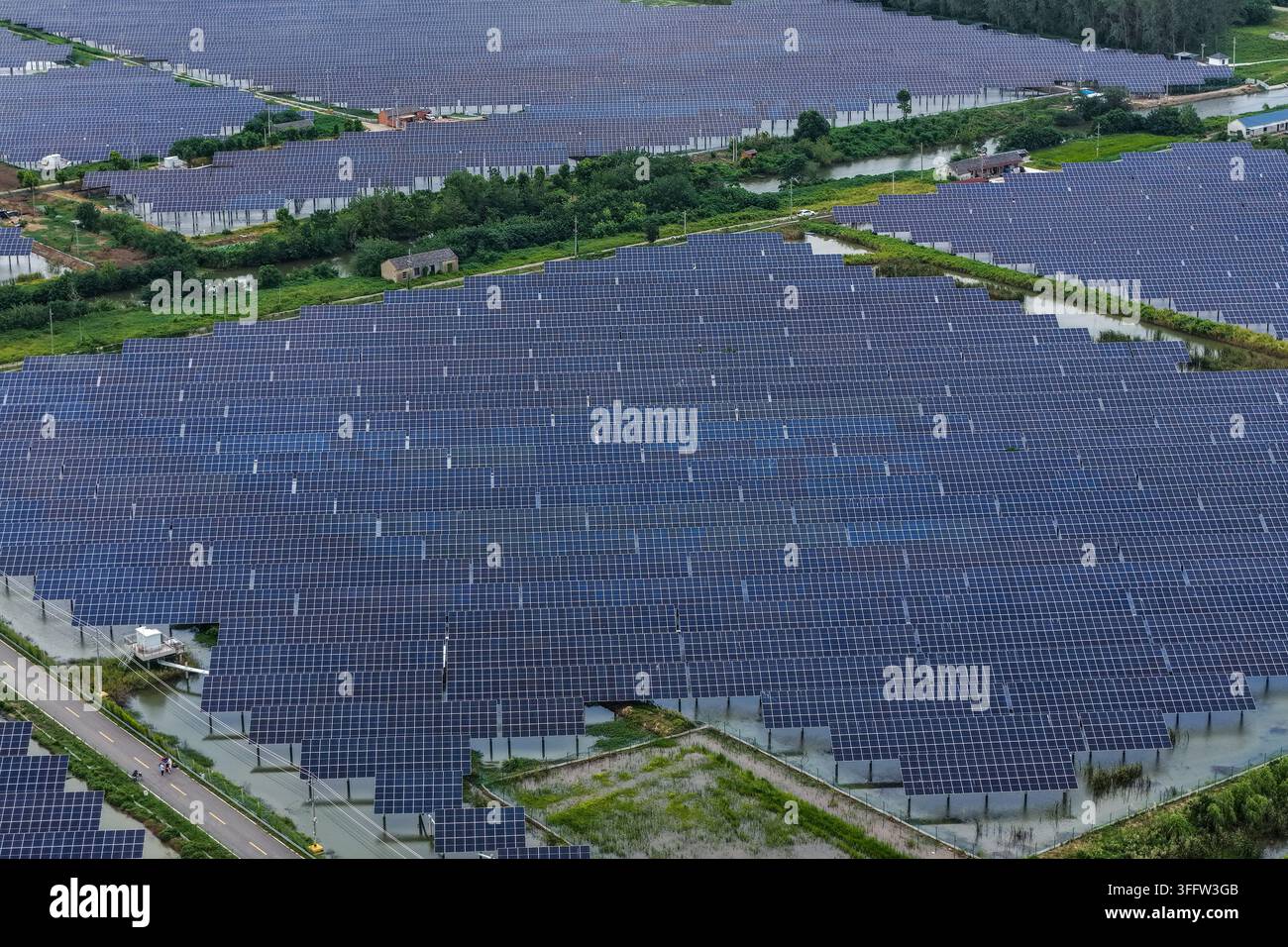 Contiguous Images YANGZHOU, CHINA - SEPTEMBER 9, 2026 - Photovoltaic panels are evenly ...