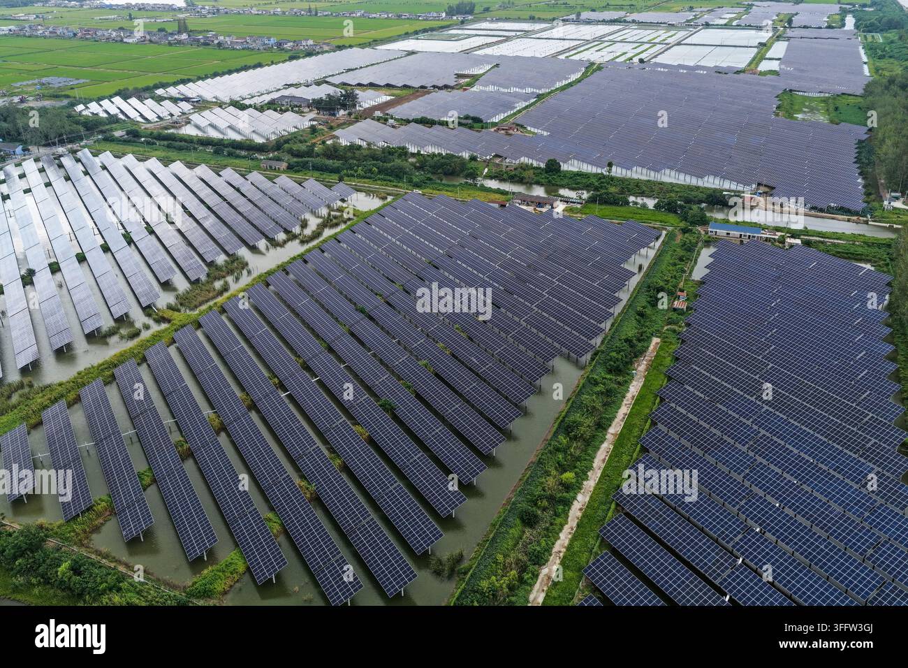 Contiguous Images YANGZHOU, CHINA - SEPTEMBER 9, 2026 - Photovoltaic panels are evenly ...