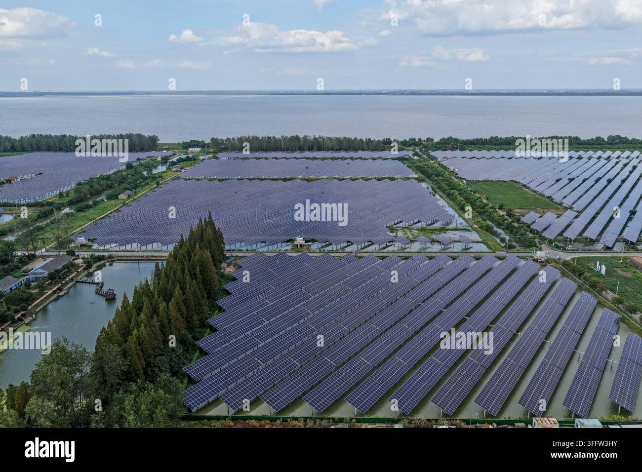 Contiguous Images YANGZHOU, CHINA - SEPTEMBER 9, 2026 - Photovoltaic panels are evenly ...