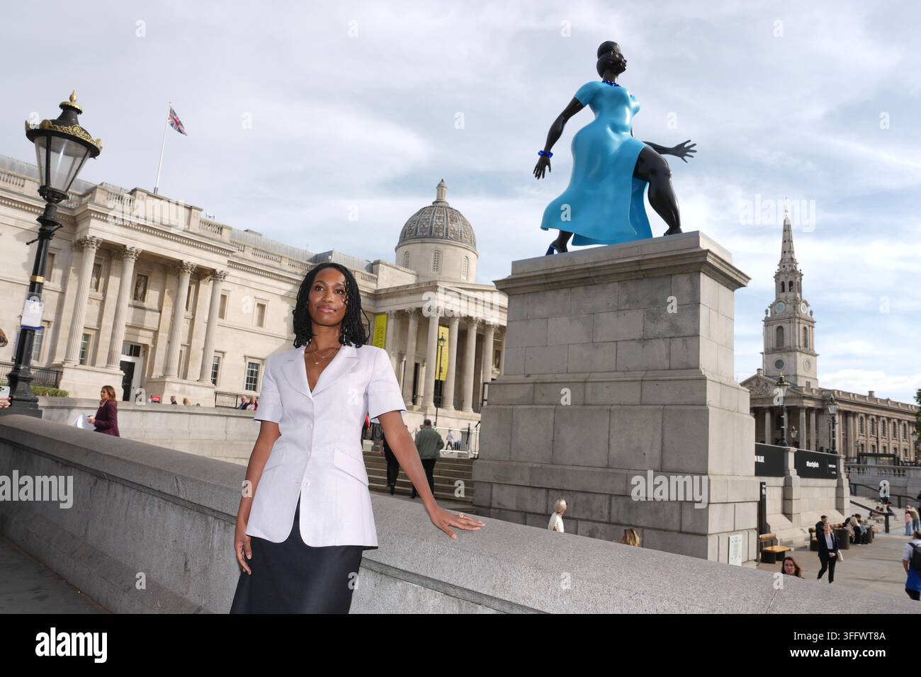 American Artist Tschabalala Self Poses Beside Her 5 meter tall 