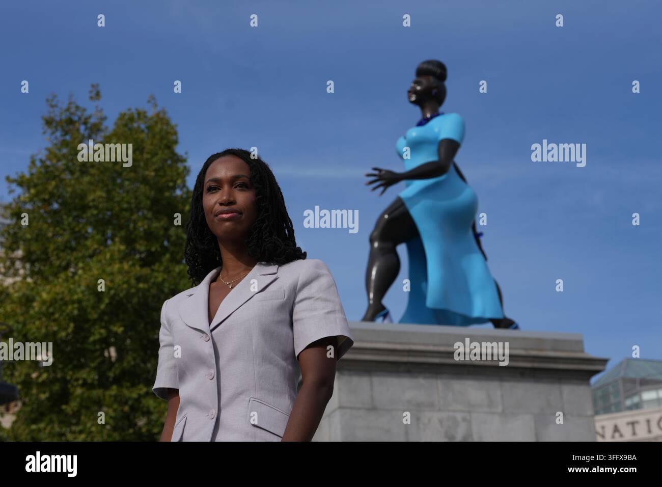 American Artist Tschabalala Self Poses Beside Her 5 meter tall 