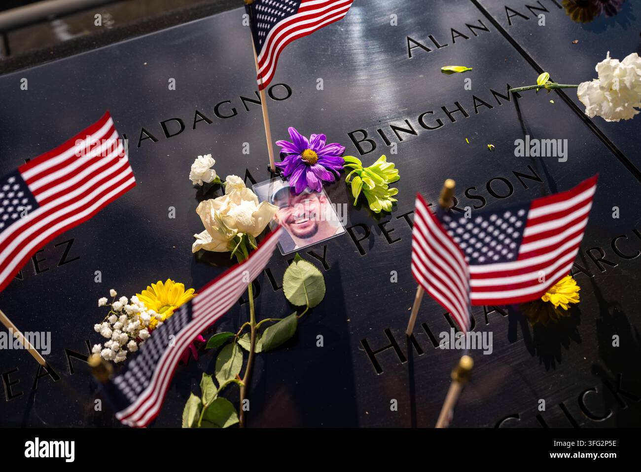 american-flags-and-a-photograph-of-mark-bingham-who-was-a-passenger-on