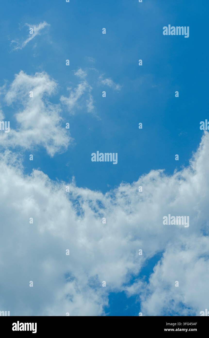 Soft White Clouds Floating in Deep Blue Atmosphere Stock Photo