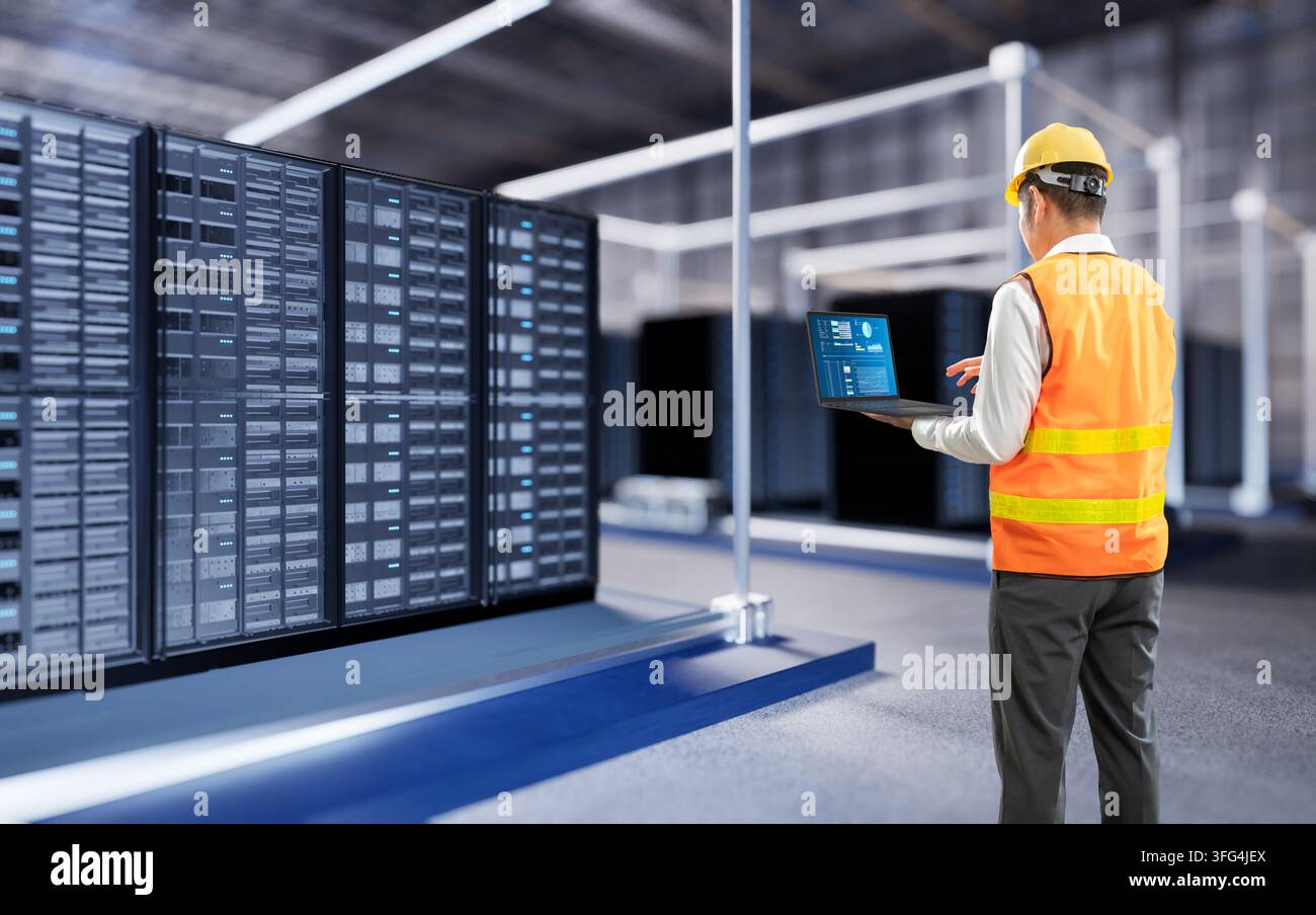 Programmer or engineer with computer notebook work in data center or server room Stock Photo