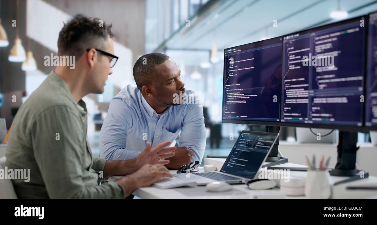 Software Engineer Reviews Code Carefully To Enhance Company Security Systems. Stock Photo