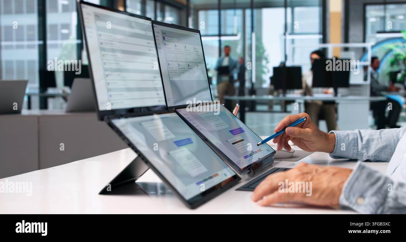 Customer Support Specialist Uses AI Chatbot On Foldable Laptop For Remote Help. Stock Photo
