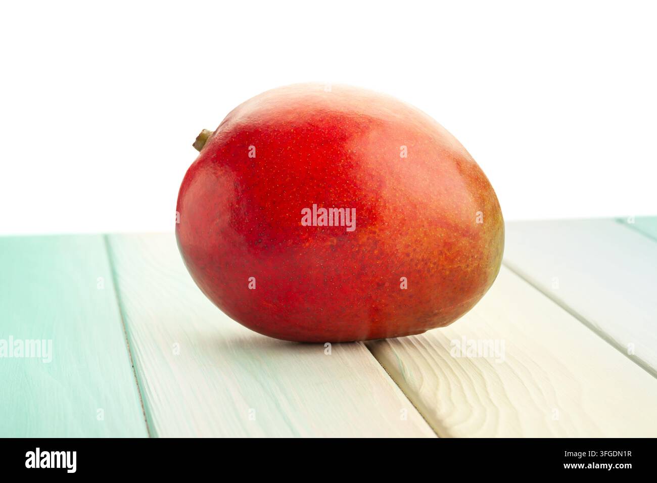 mango on wood background on white Stock Photo