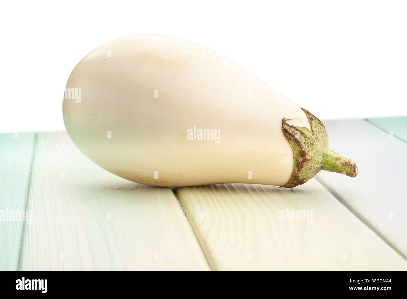 white eggplant on wood background on white Stock Photo