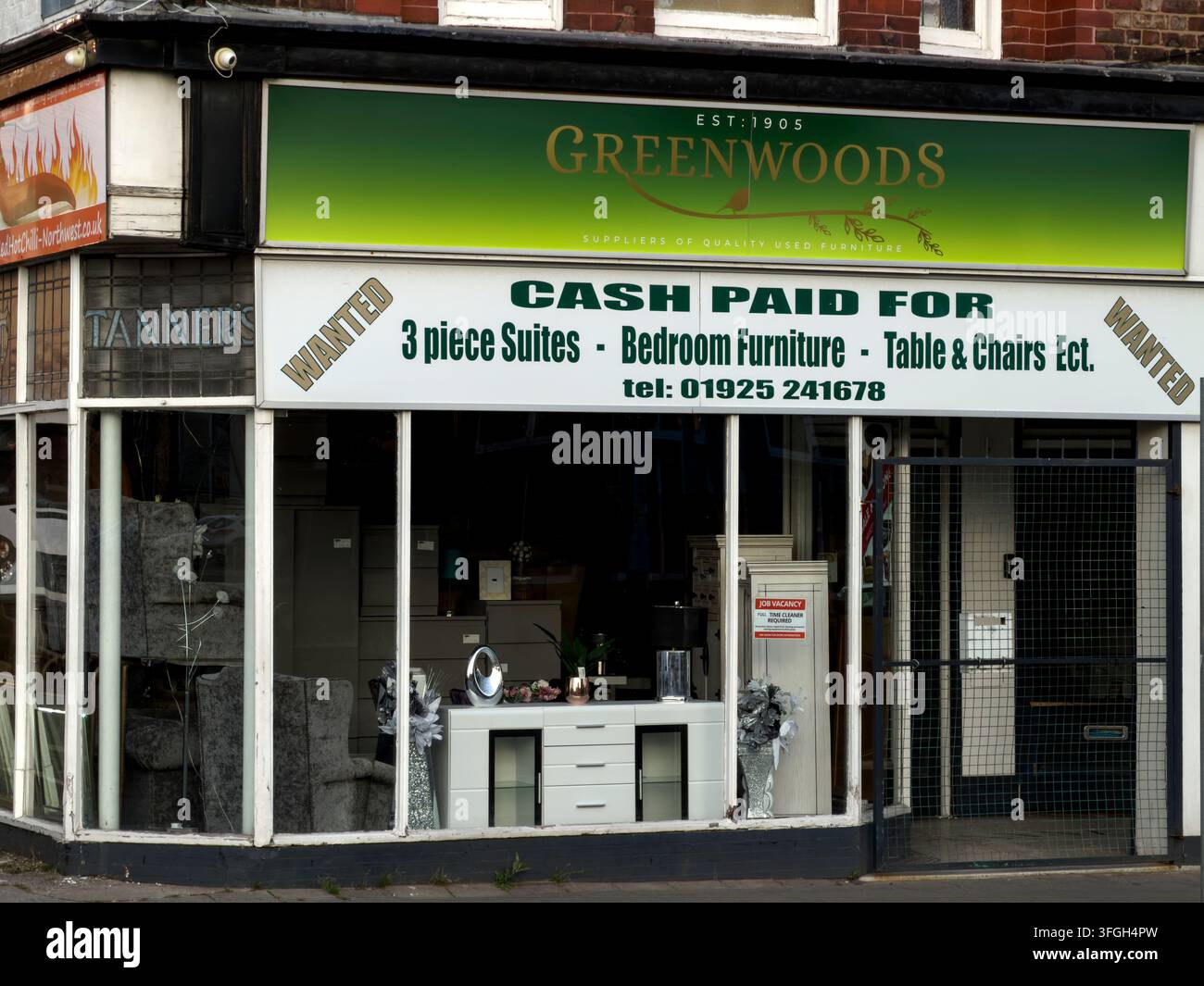 Greenwoods of Cheshire used-furniture shop on Winwick Street in Warrington, a family business established in the town in 1908. Stock Photo