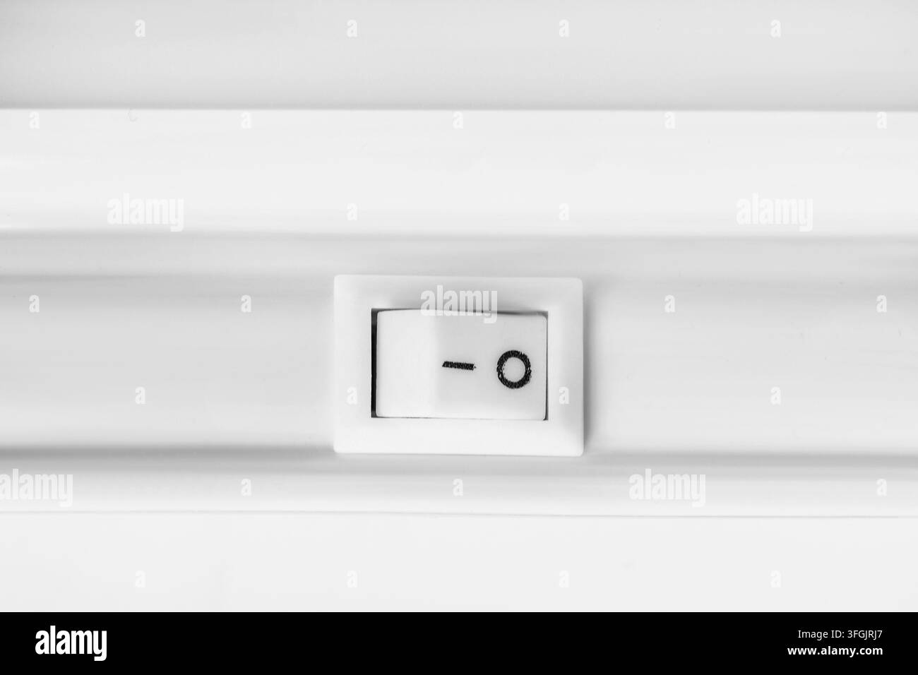 White plastic device switch toggle button closeup Stock Photo
