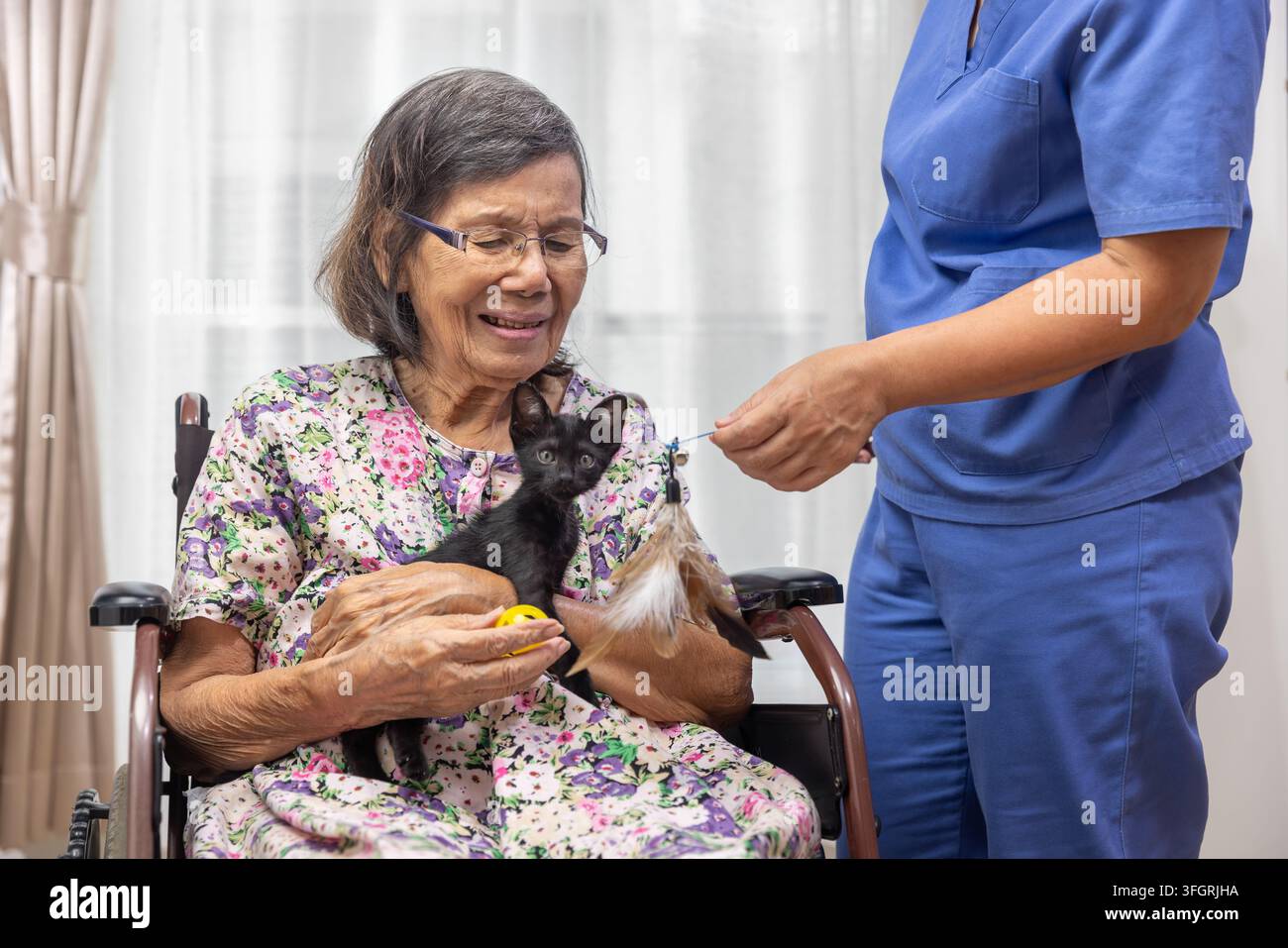 Elderly woman holding baby in hi-res stock photography and images - Alamy