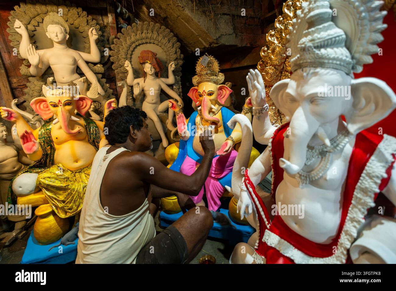 Craftsperson Prepares Lord Ganesha Idols On The Eve Of Ganesh Chaturthi Craftsperson Prepares Lord Ganesha Idols On The Eve Of Ganesh Chaturthi