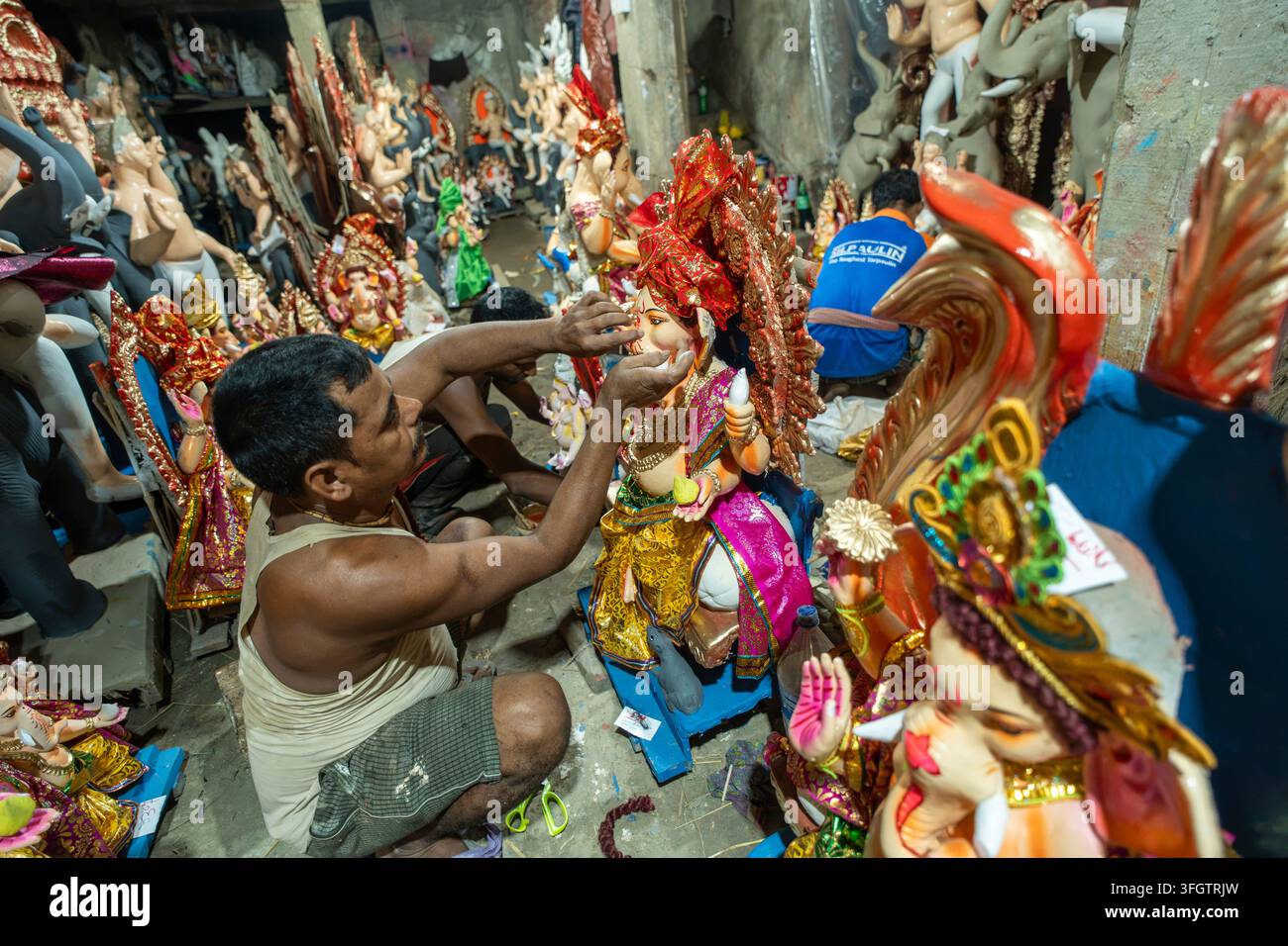 Craftsperson Prepares Lord Ganesha Idols On The Eve Of Ganesh Chaturthi Craftsperson Prepares Lord Ganesha Idols On The Eve Of Ganesh Chaturthi