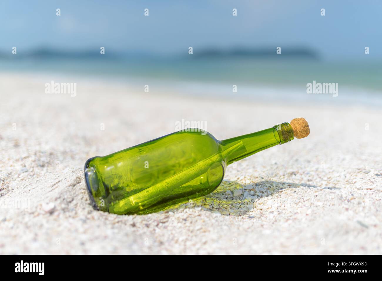 Message in a bottle (MIB) on a sand beach Stock Photo