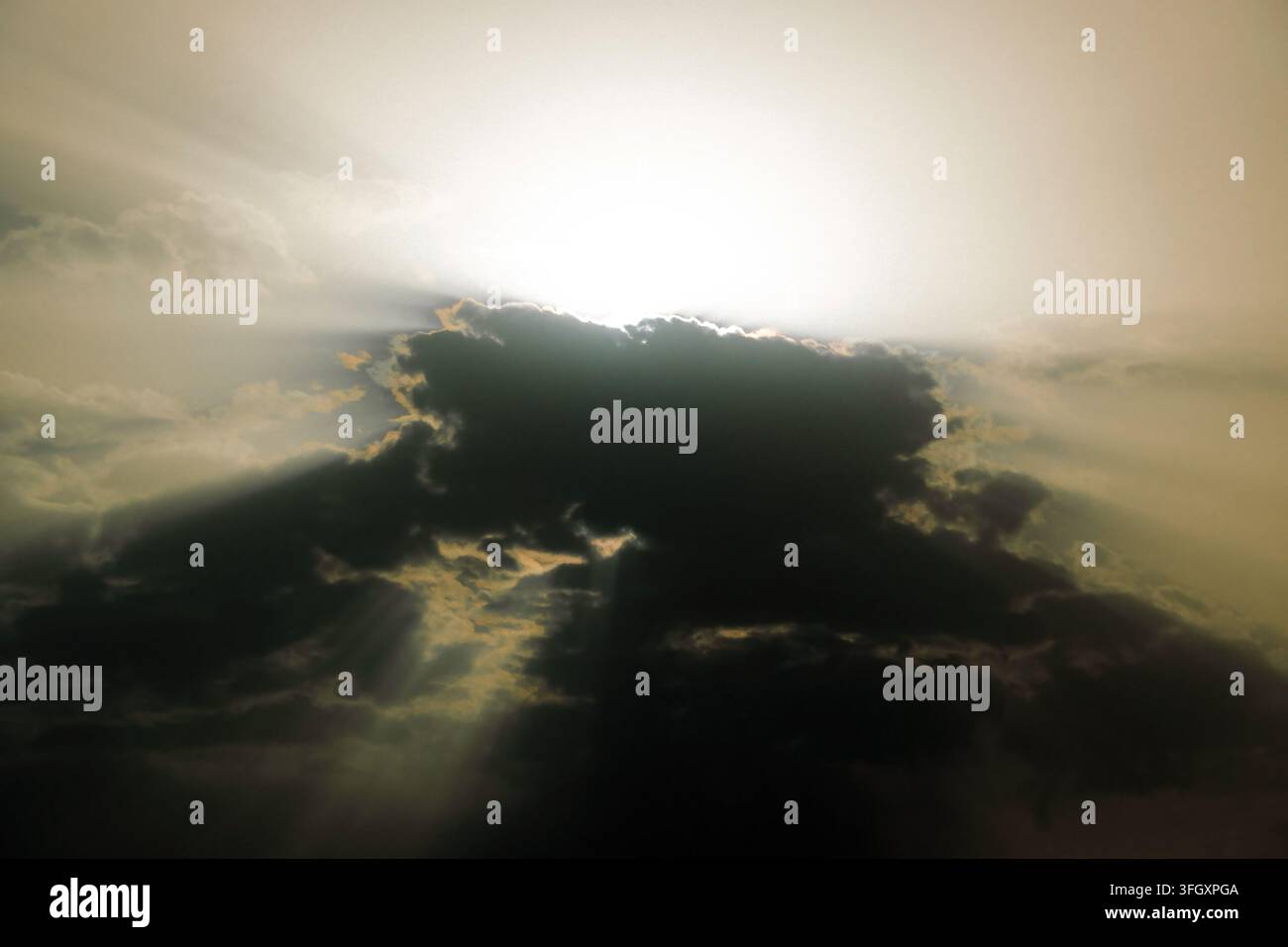 Bright sun rays breaking through dark clouds Stock Photo