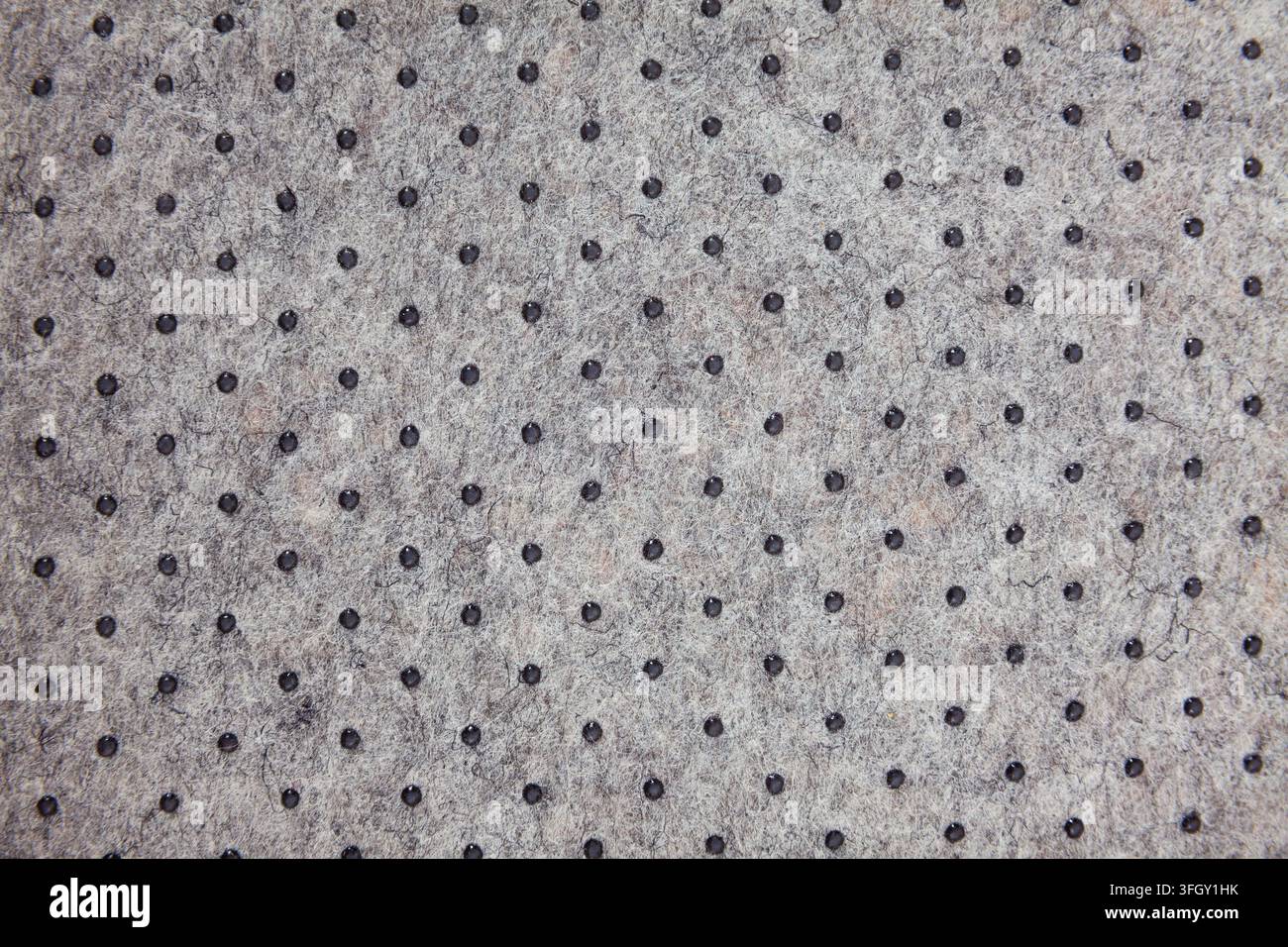 Surface of felted polyester fabric texture with plastic dots Stock Photo