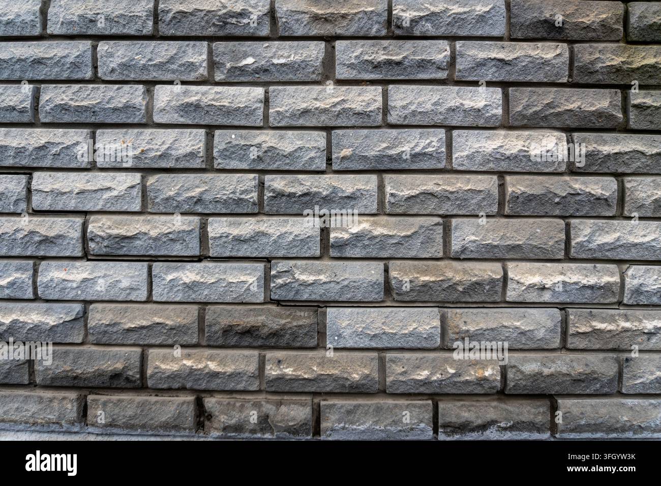 Grey decorative stone wall masonry texture background Stock Photo