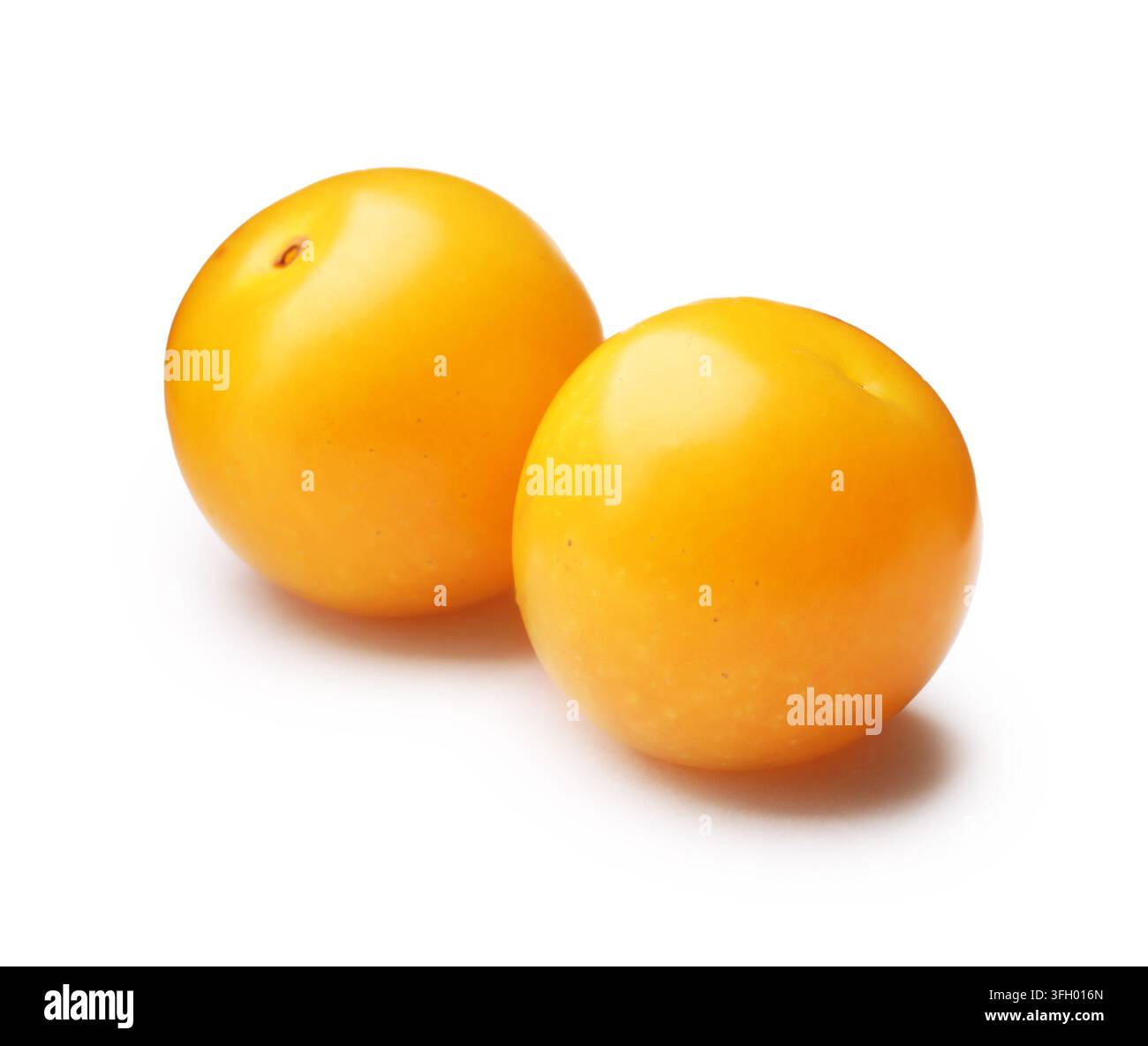 Two yellow cherry plums isolated on white Stock Photo
