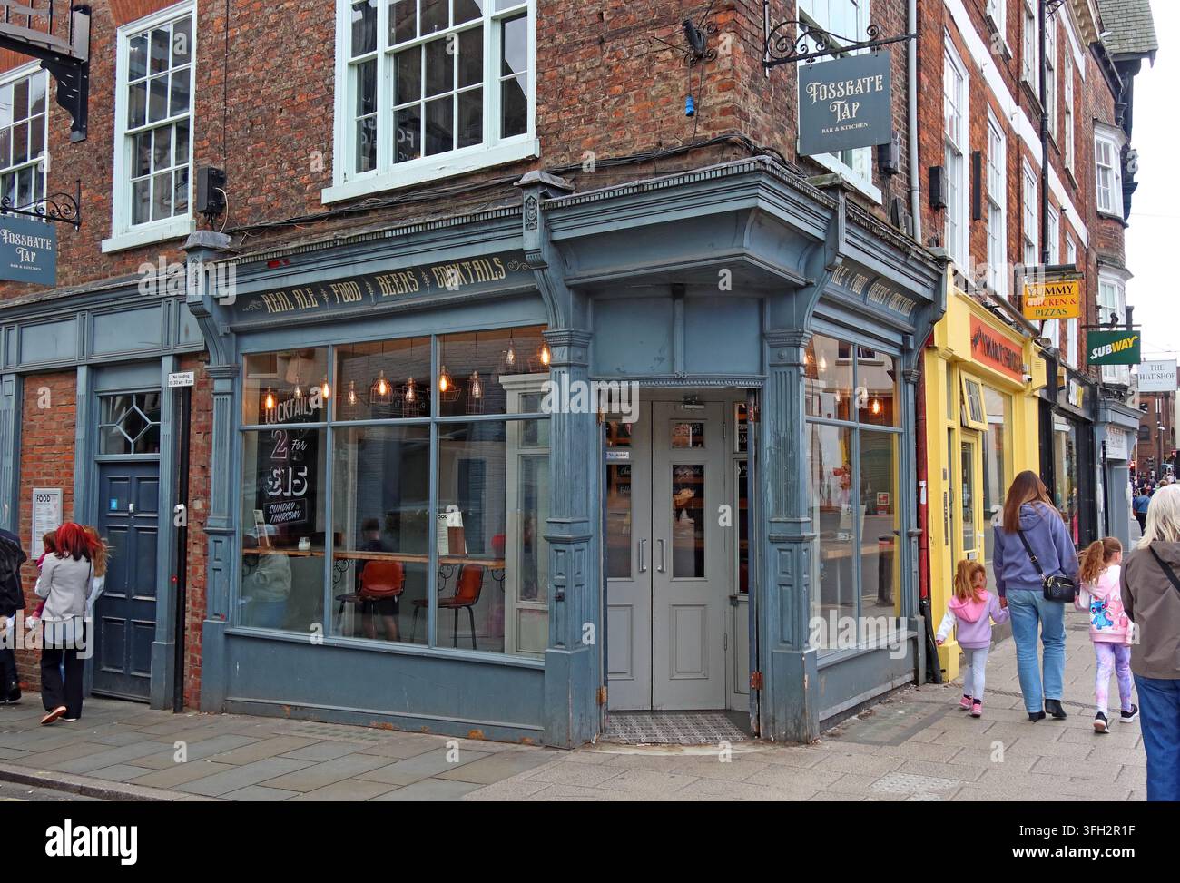 Fossgate Tap pub and bar on the corner of Fossgate in York, retaining historic Army and Navy Stores lettering above the frontage. Stock Photo