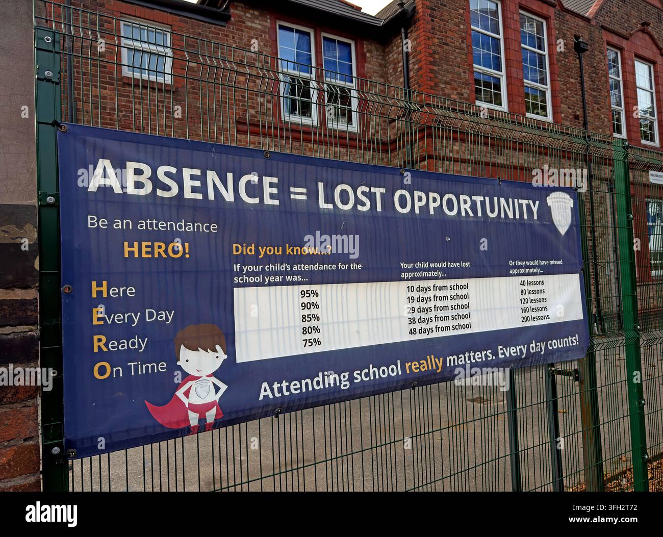 Beamont Primary Academy attendance banner in Warrington warning that absence means lost opportunity and urging pupils to attend daily. Stock Photo