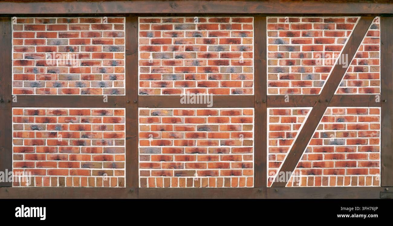 Half-timbered - brown beams filled with red patterned bricks Stock Photo