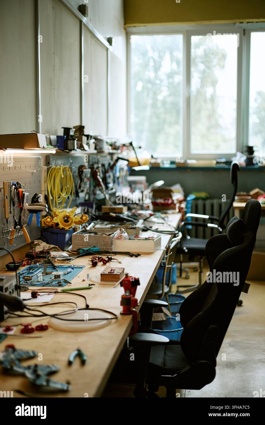 Electronics Engineering Workshop with Tools on Workbench Stock Photo