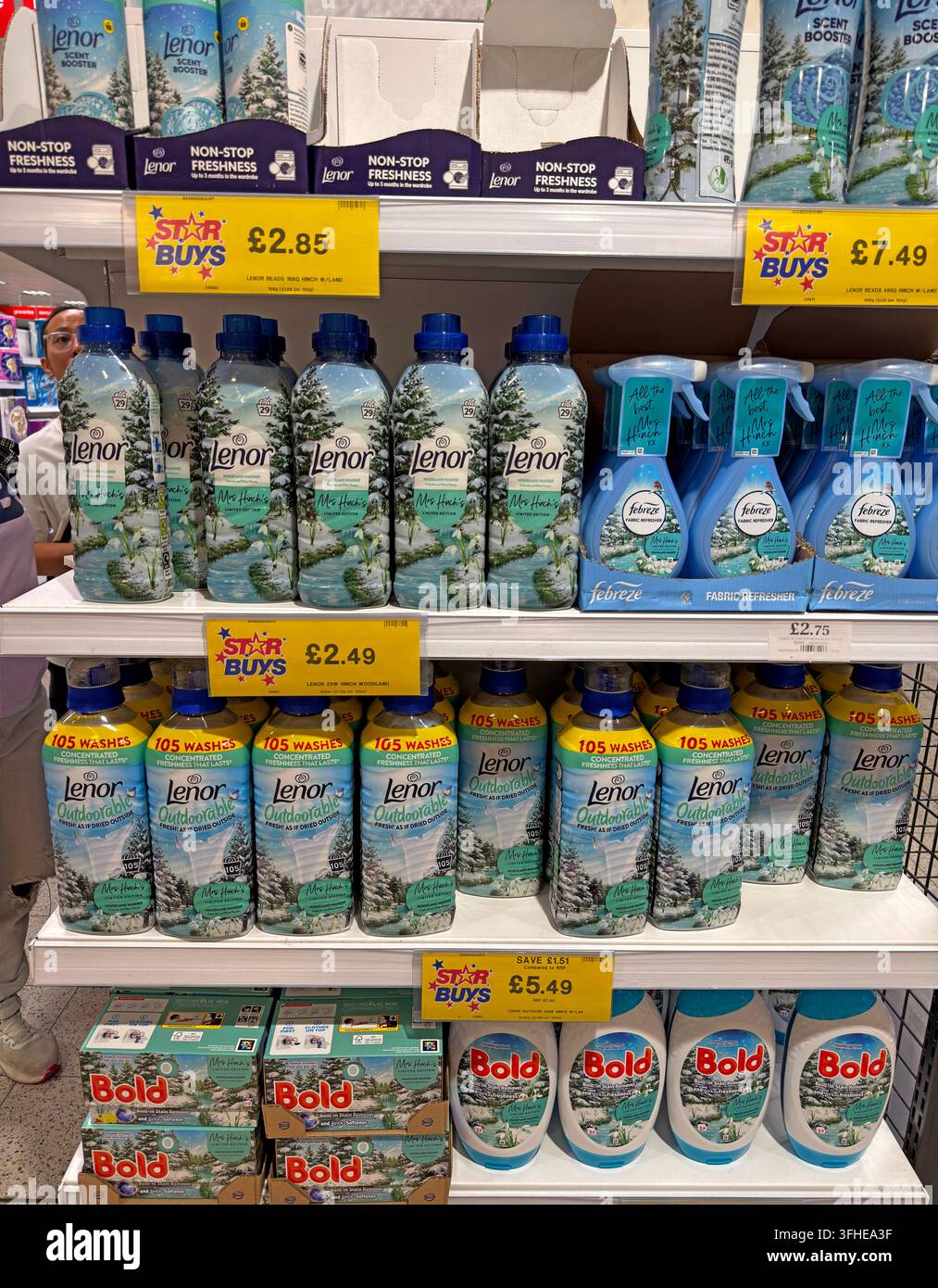Lenor, Bold and other fabric conditioners and laundry products displayed on shelves in a UK supermarket. Stock Photo