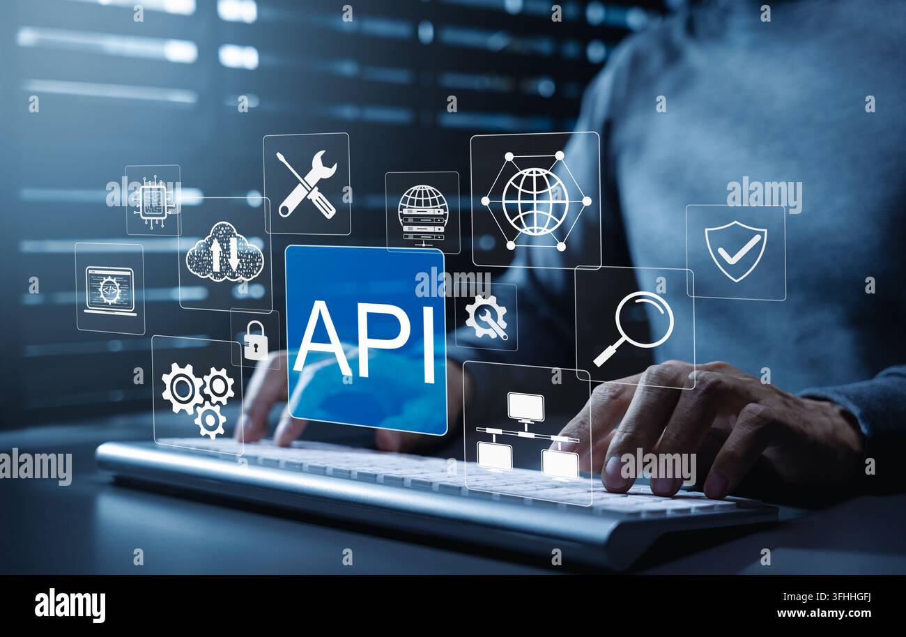 API Application Programming Interface software integration concept. Developer typing on keyboard with icons representing API development, security, cl Stock Photo