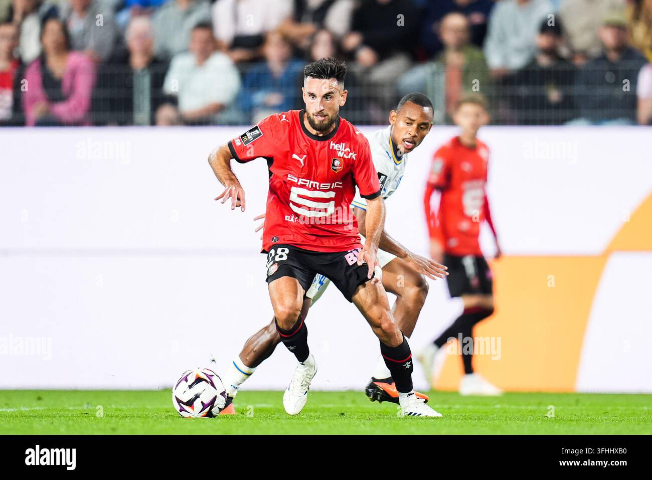 Adrien THOMASSON of Rennes and Igor PAIXAO of Marseille during the ...