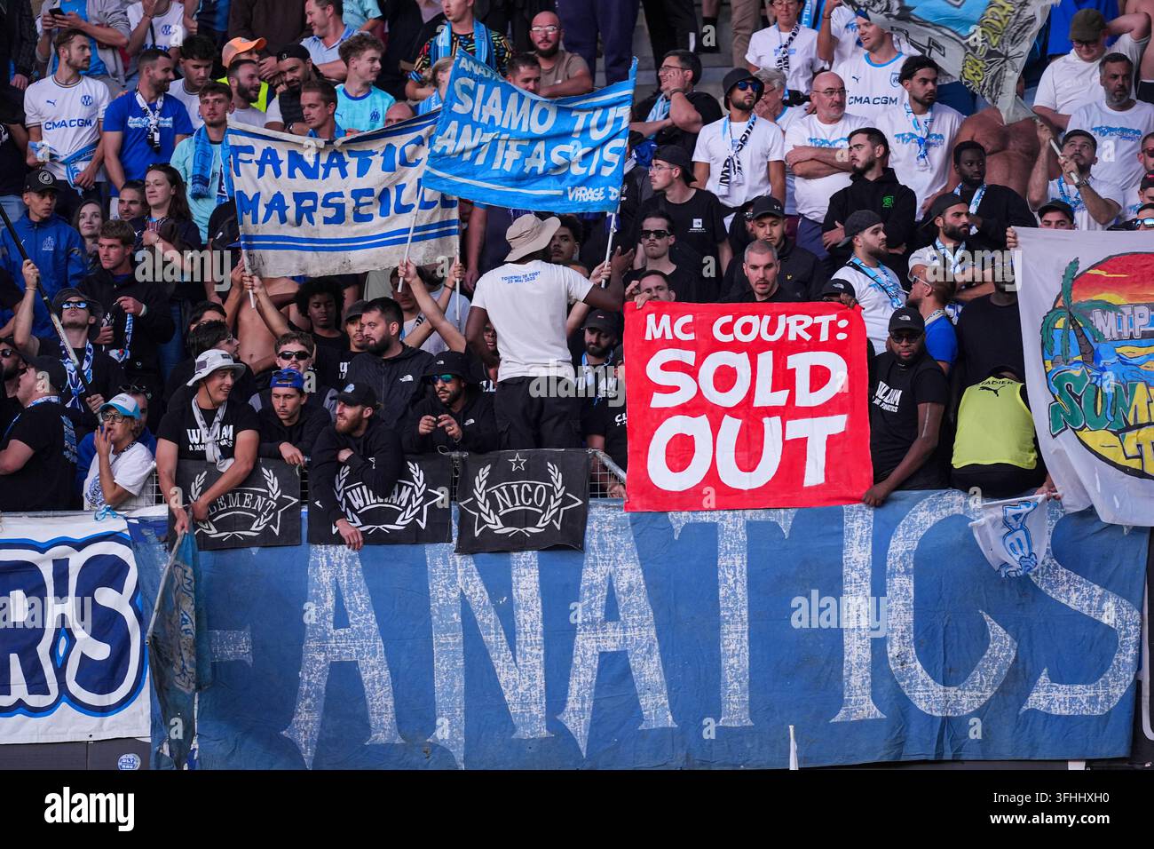 Fans of Marseille show a cardboard against Franck MC COURT being 