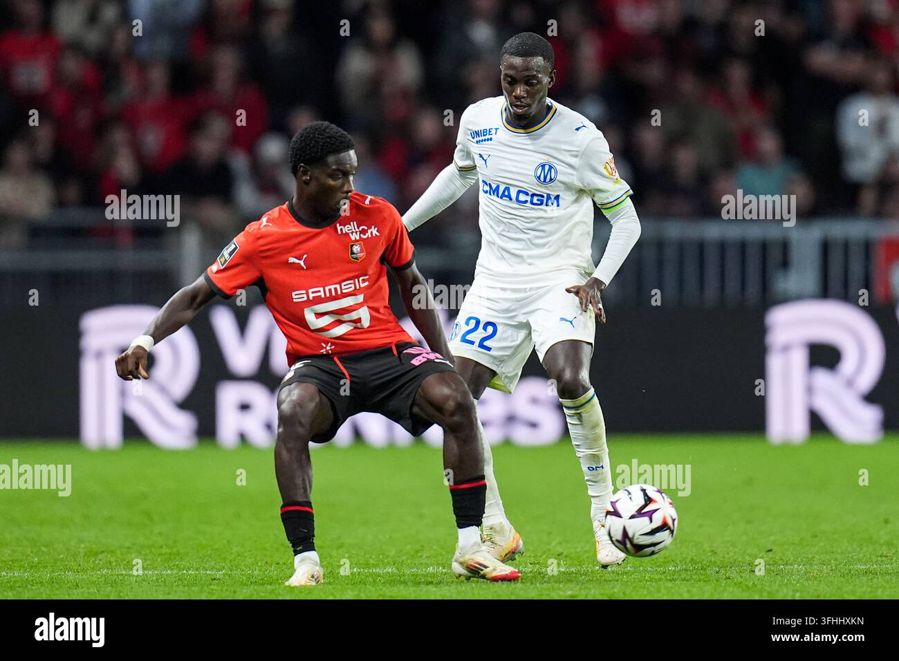 Timothy WEAH of Marseille and Elieze MAYENDA of Rennes fight for the ...