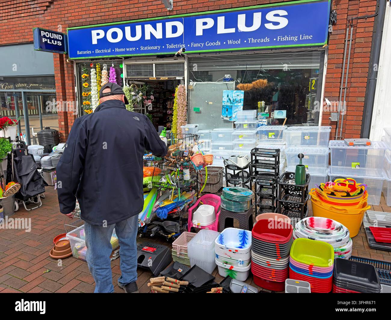 Pound Plus discount shop at 13 Chapel Street in Chorley town centre, Lancashire, with household goods displayed outside. Stock Photo
