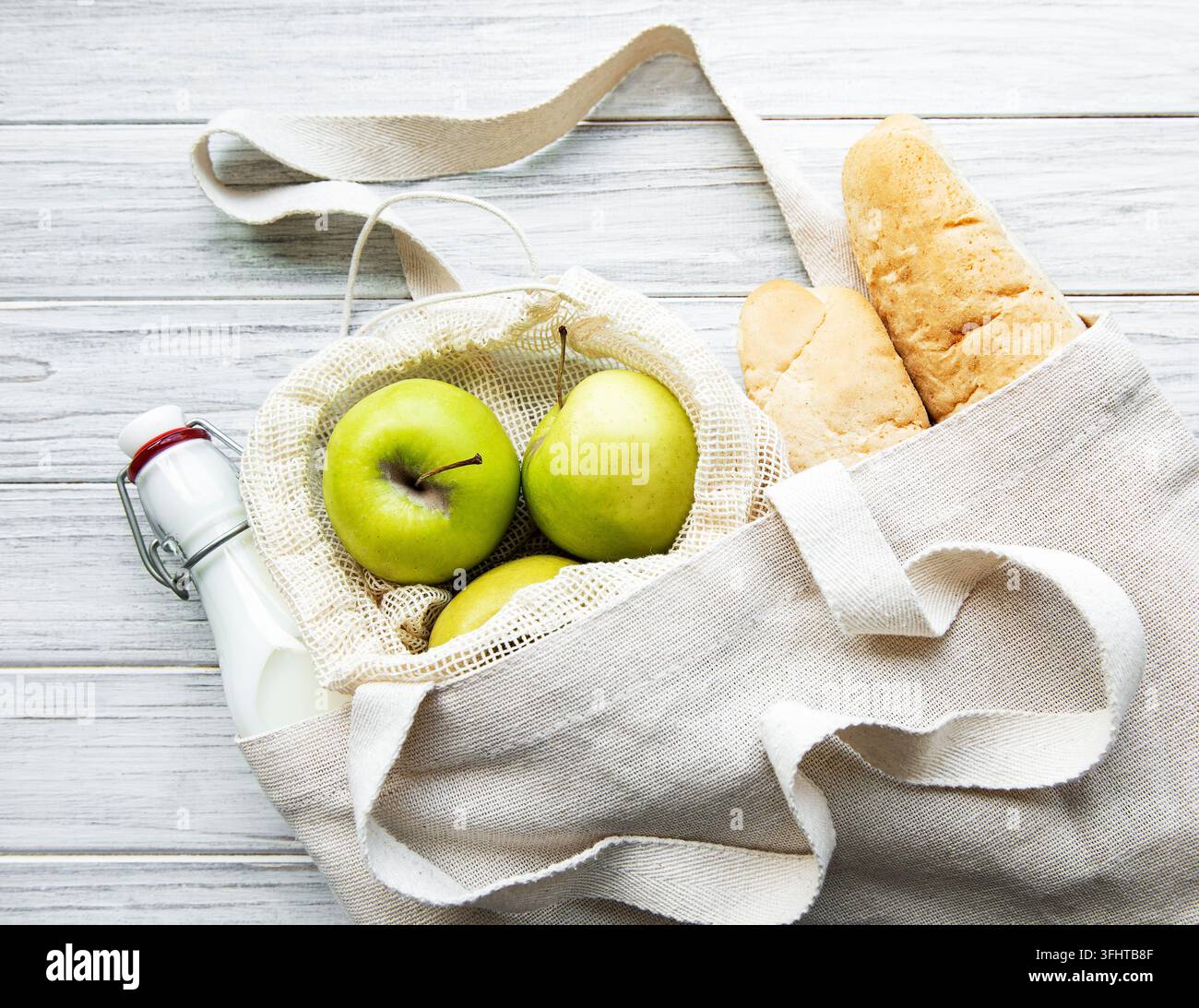 Fresh apples, milk and bread  in eco cotton bag Stock Photo