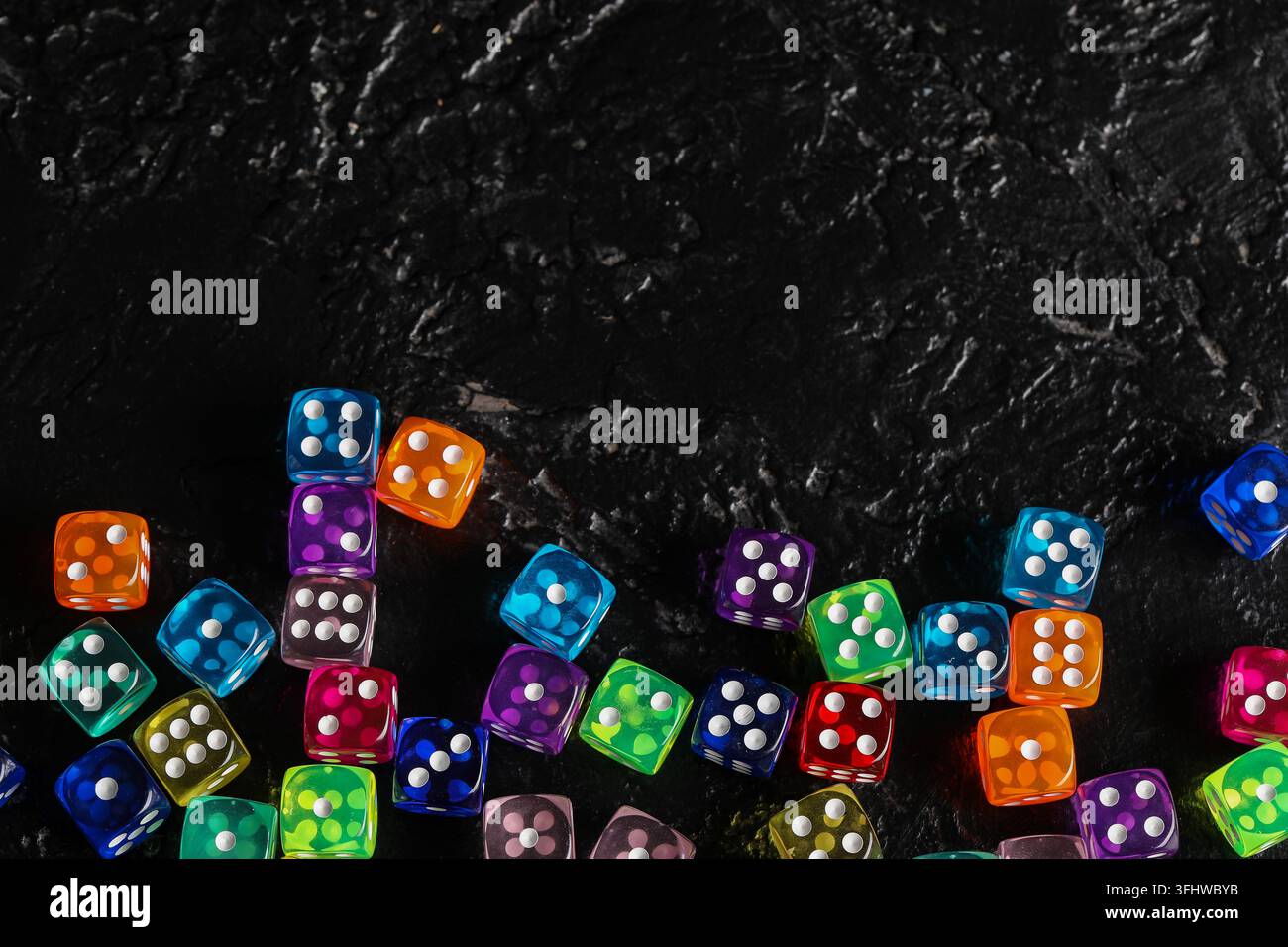 Colorful game dices on black background Stock Photo