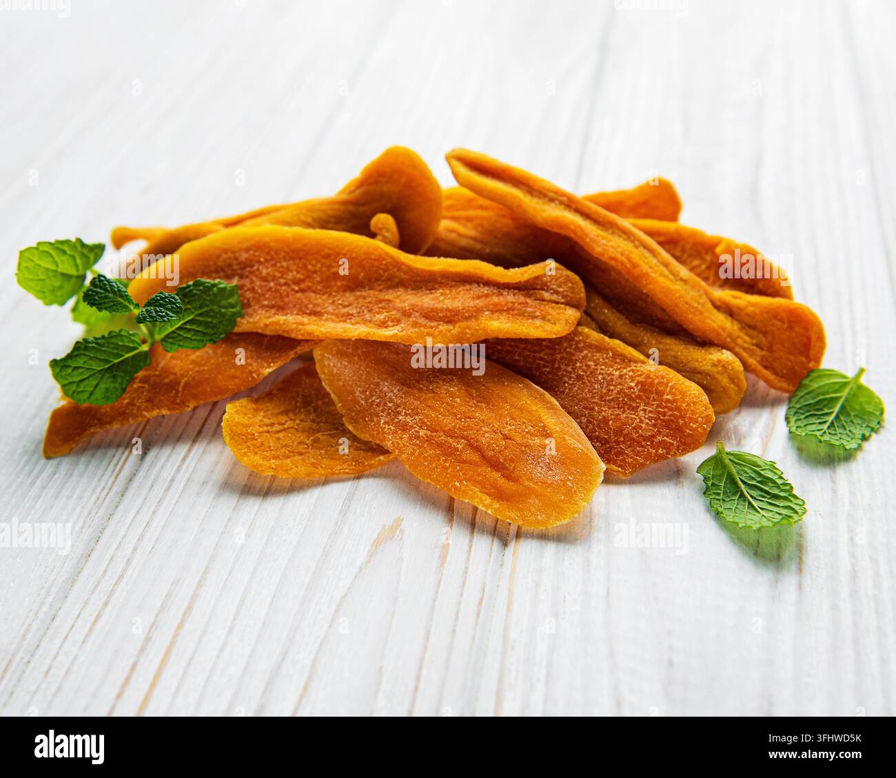 Dried Mango Fruit on Old Wooden Background Stock Photo