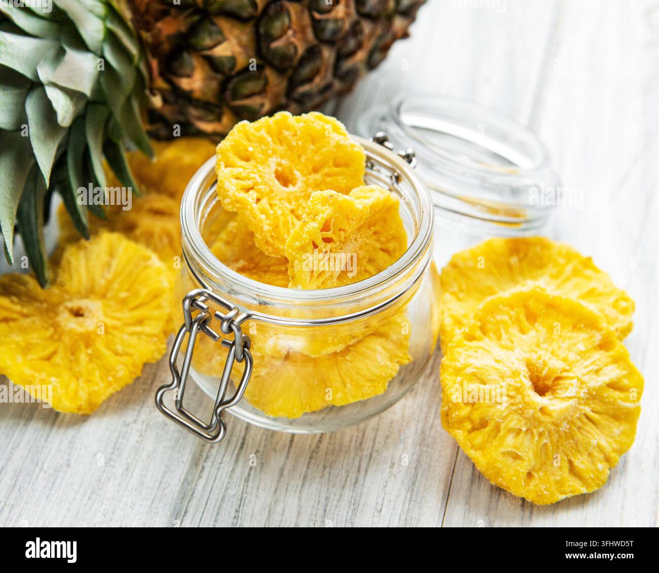 Pineapple dried rings on rustic wooden background Stock Photo