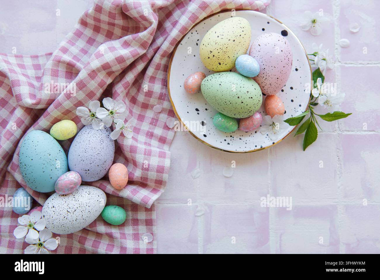 Colorful Easter eggs on plate Stock Photo