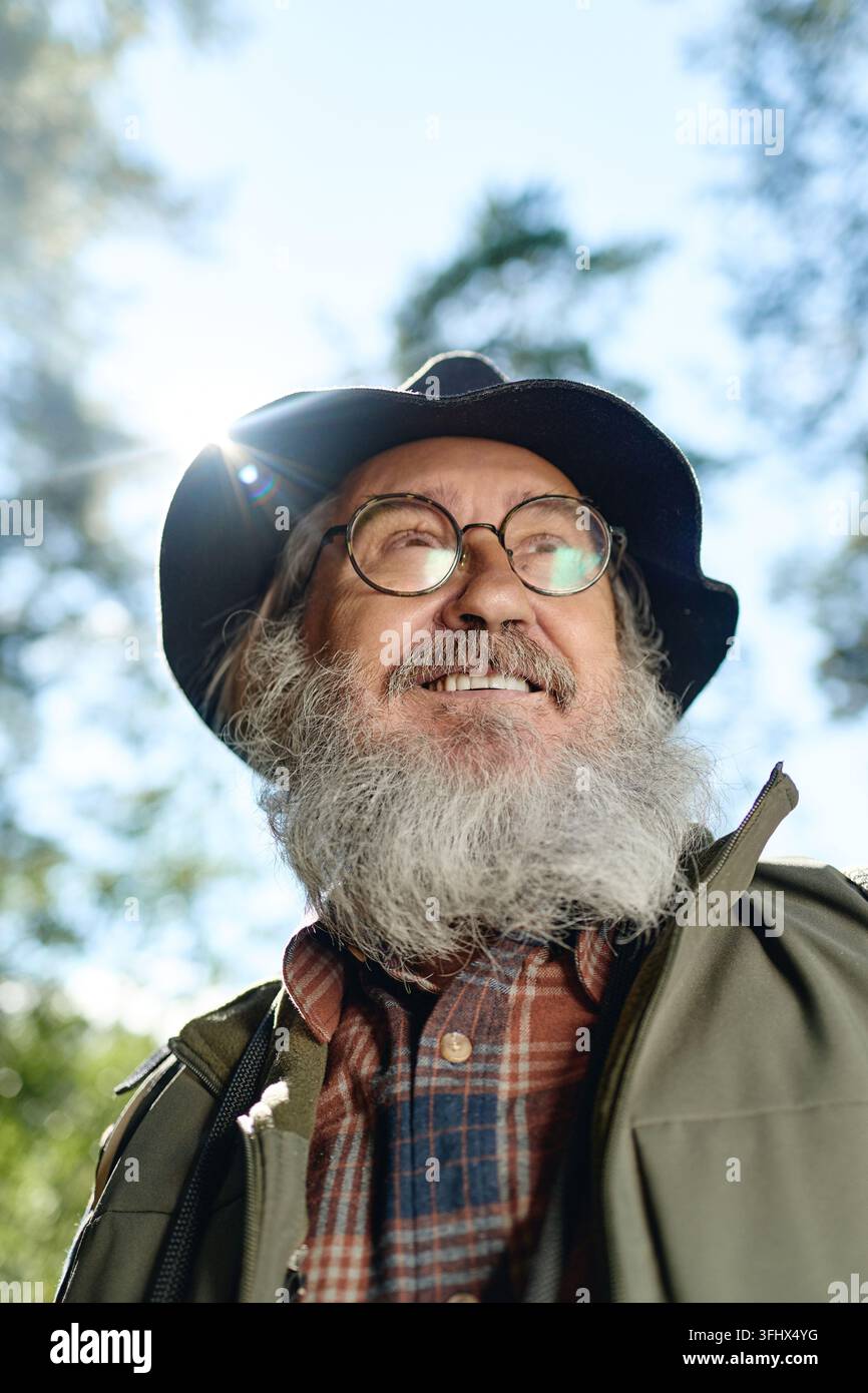Happy Senior Man Enjoying Hiking Outdoors in Nature Stock Photo