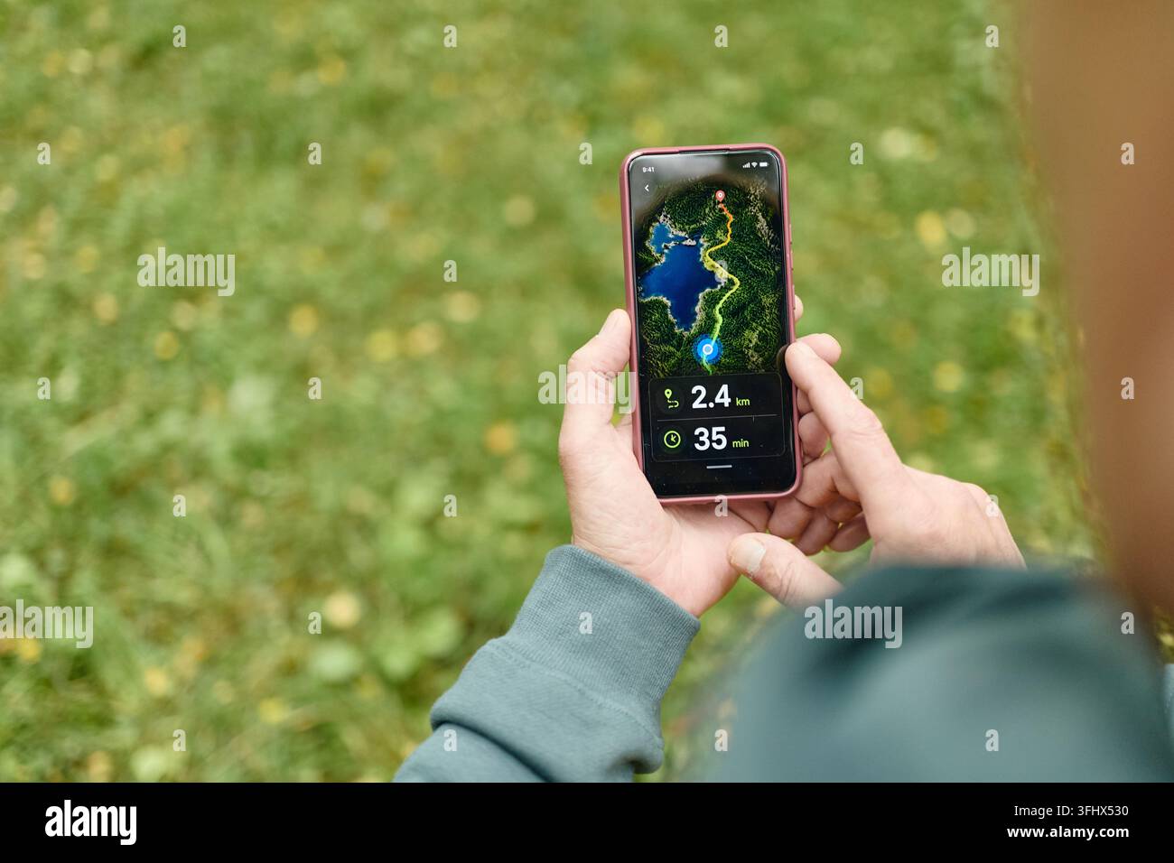 Senior Man Using Navigation Map App on Smartphone Outdoors Stock Photo