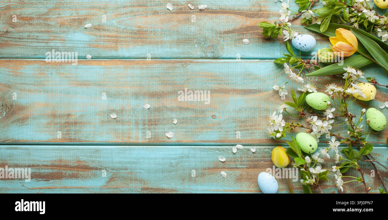 Easter background with   colored eggs and decorations on green background . Top view. Flat lay Stock Photo