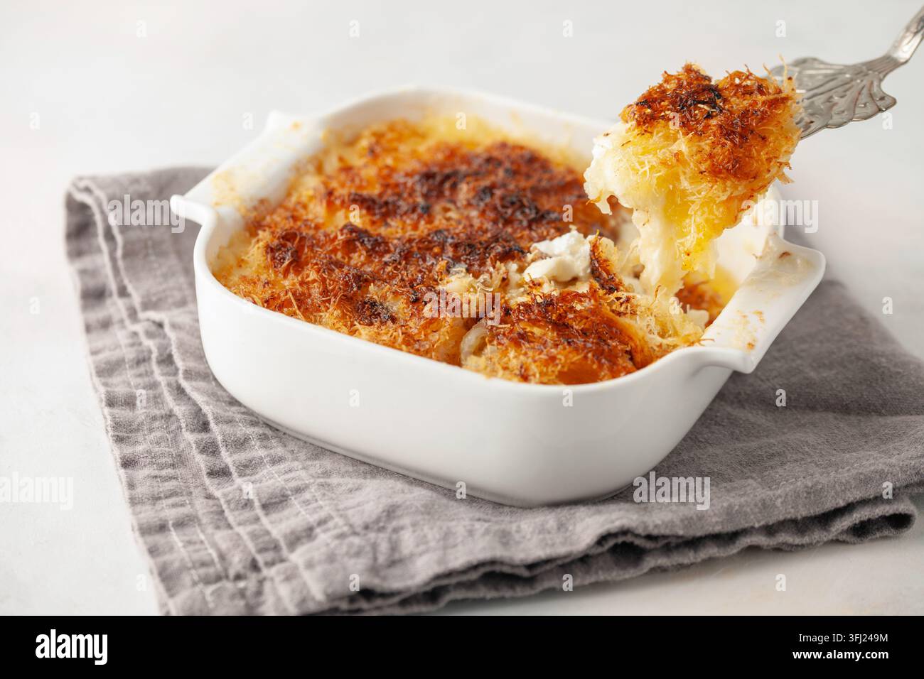 Turkish Dessert Kadayif with pistachio powder - Burma kadayif lose up view of delicious Arabic kataifi. kadayif pastry nest cook Stock Photo