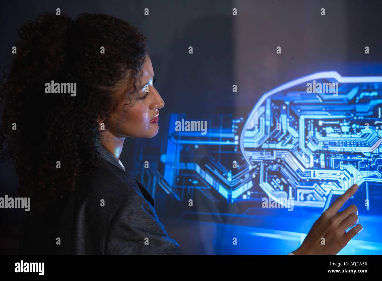 Business professional interacting with a digital human interface, representing artificial intelligence, machine learning, human technology collaborati Stock Photo