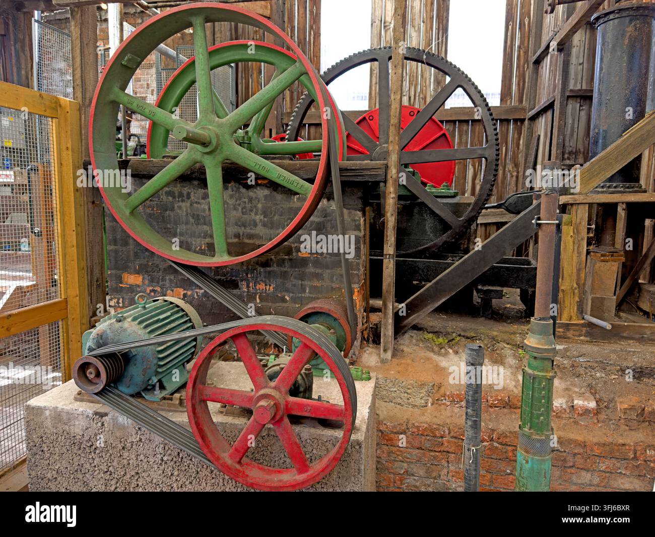 Electric motor, flywheels and gearing driving the historic nodding-donkey brine pump at Lion Salt Works near Northwich. Stock Photo