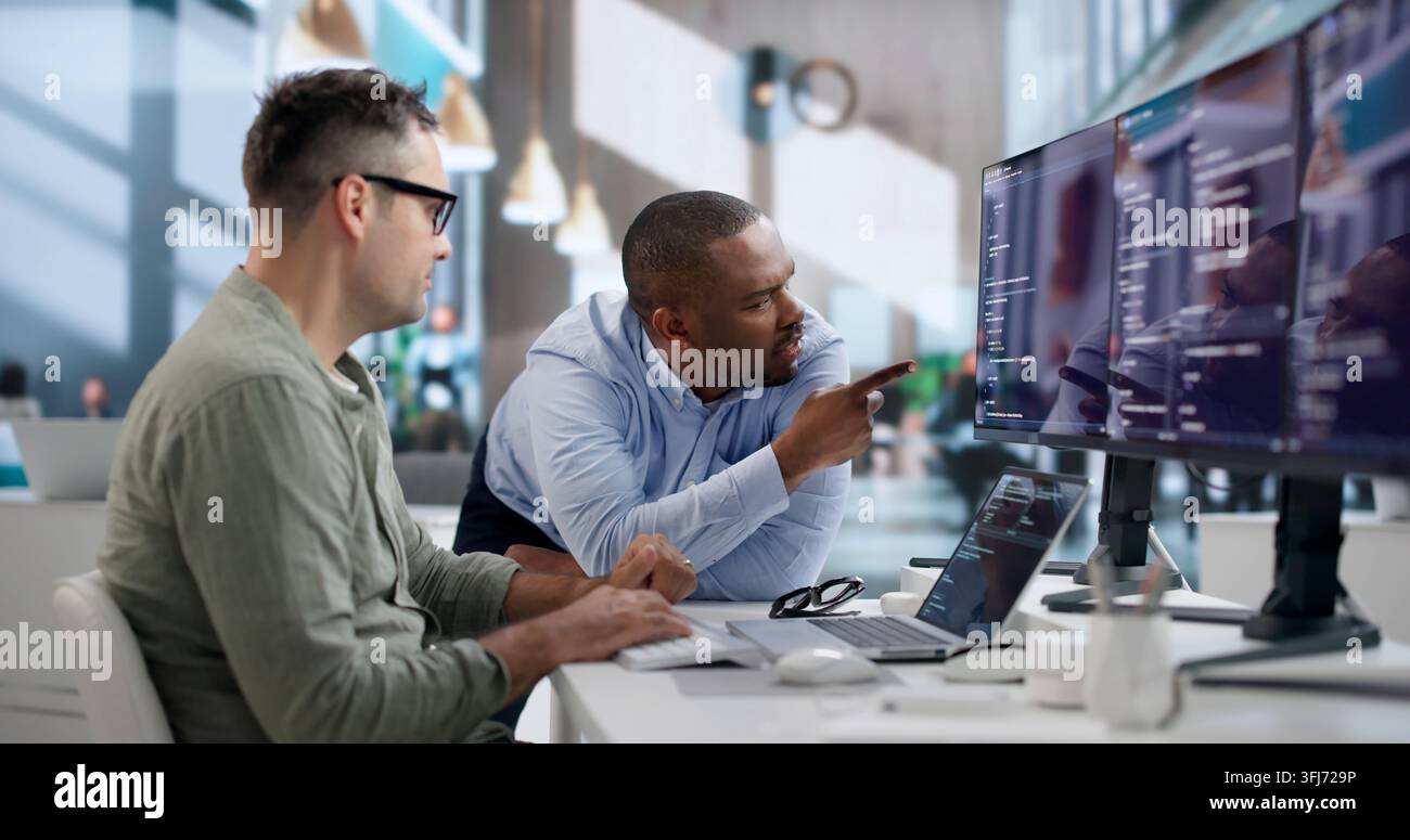 Software Engineer Collaborates With Team To Develop Secure Code. Stock Photo