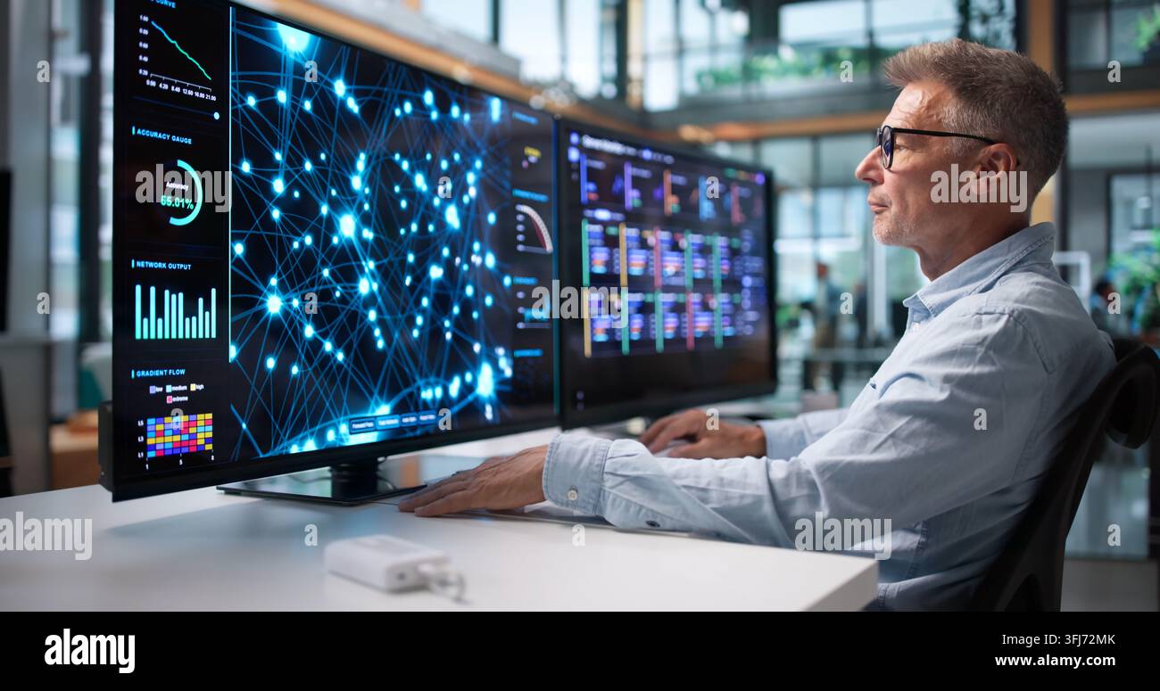 Data Scientist Analyzes Data On Desktop, Building AI Models For Predictive Analytics. Stock Photo