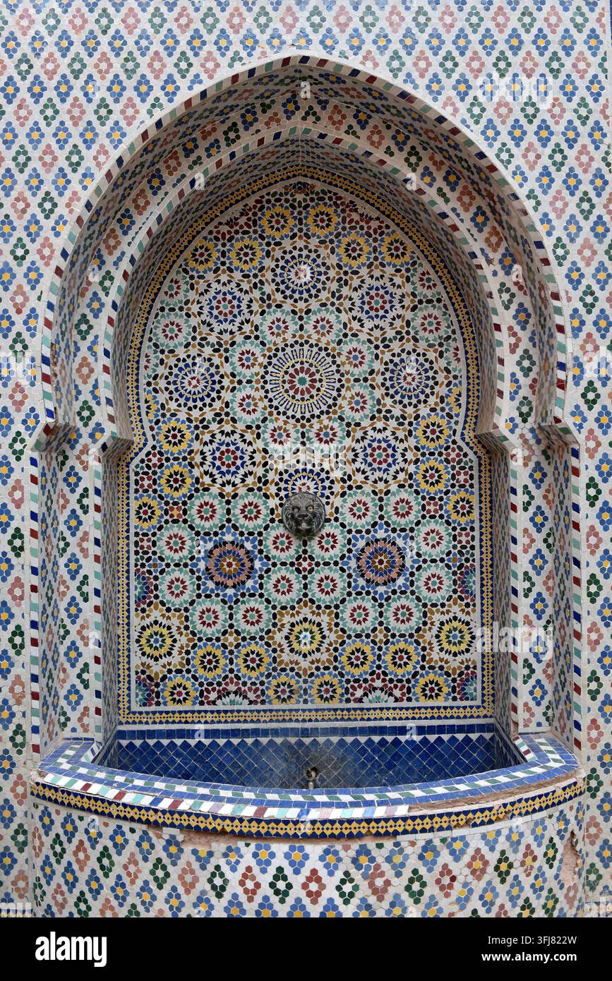 Traditional Moroccan zellij tile fountain in Marrakesh, Morocco Stock Photo