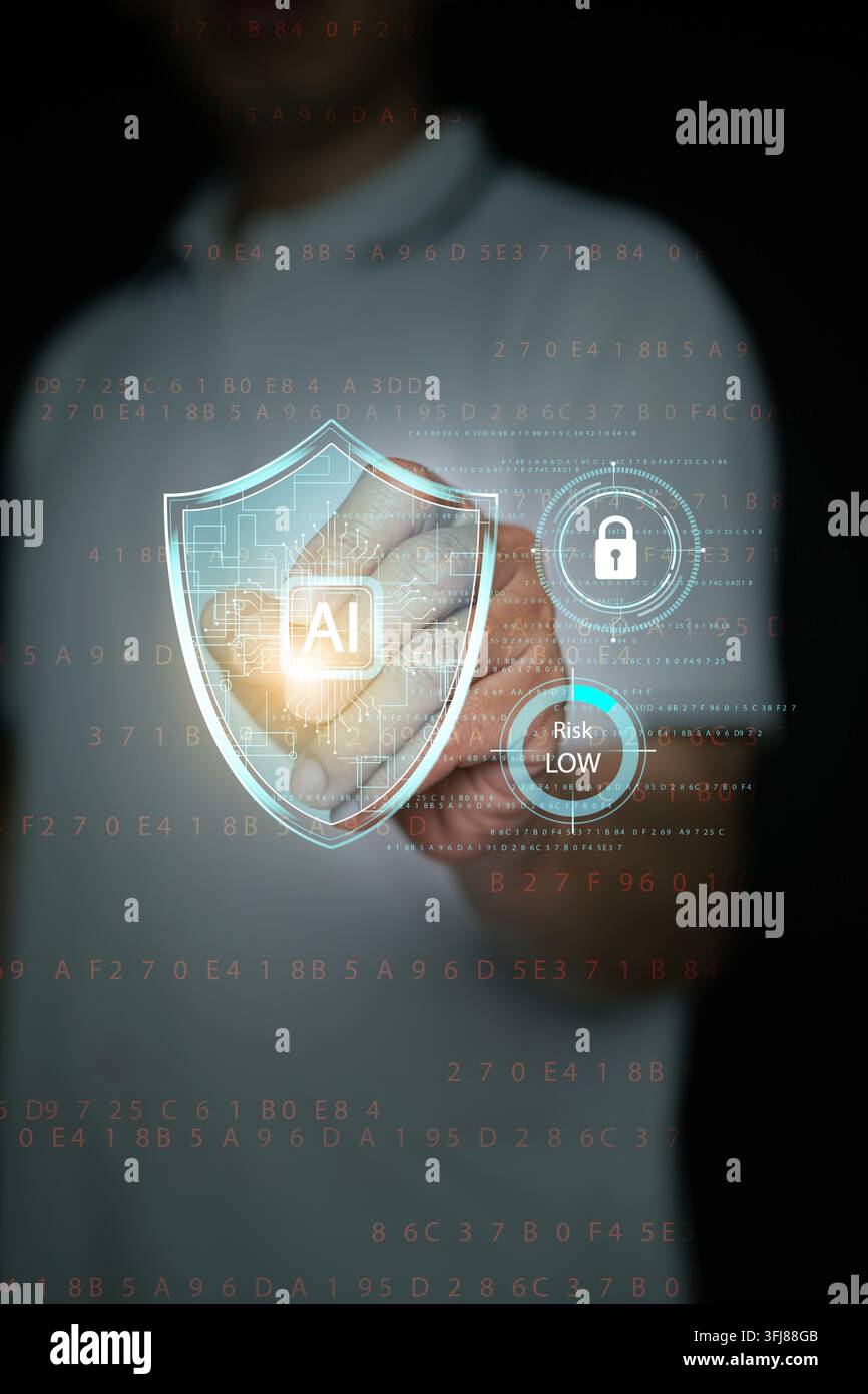 Finger touching AI shield hologram with lock icon and low risk indicator over digital code background. Artificial intelligence cybersecurity, data pro Stock Photo