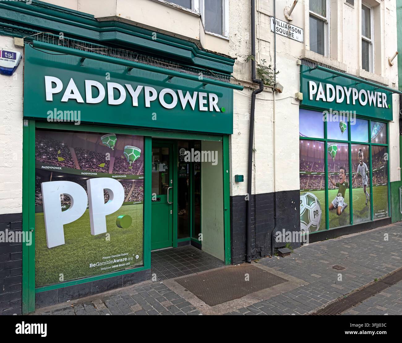 Paddy Power betting shop in Williamson Square, Liverpool, with prominent green branding and gambling promotions, gaming levy, duty coming Stock Photo